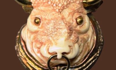 Impressive Taurus the Bull Zodiac sign pendant. Gold tone jewelry alloy, white plastic