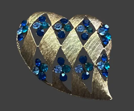 Heart shape brooch of gold tone, blue rhinestones