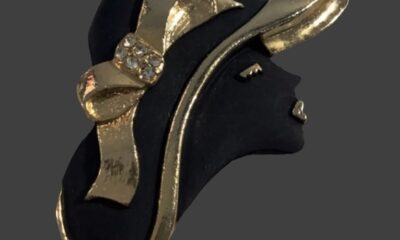 Lady in hat, black enamel gold tone brooch