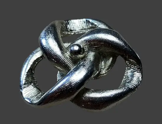 Silver and gold tone shoe clip
