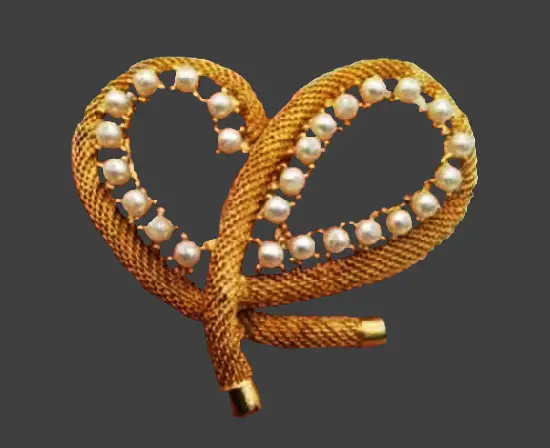 The Bowen Knot, a symbol of an unbreakable link between lovers, gold tone faux rhinestones brooch